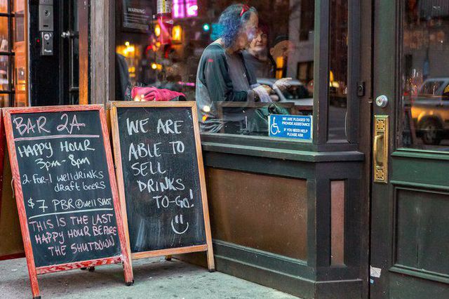 A chalkboard that reads: "We are able to sell to-go drinks"